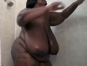 This Giant ebony doll strokes in the shower. Her ample ebony