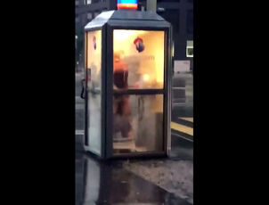 Brit duo drills in telephone booth in center of city