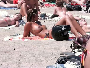 Luxurious female stripped to the waist in  beach hidden cam