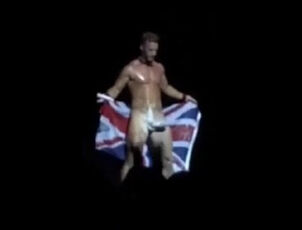 Masculine stripper juggling yam-sized manmeat on stage at